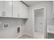 Clean laundry room with cabinets, utility sink, and designated appliance hook-ups at 3450 Commander Cv, Suwanee, GA 30024