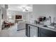 Open-concept living area with a bar area, complete with a wine fridge and sink at 3450 Commander Cv, Suwanee, GA 30024