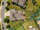 Aerial view of a home featuring a well manicured yard, mature landscaping, and a pool at 4430 Alister Park Dr, Cumming, GA 30040