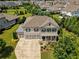 Aerial view of large two-story home with three car garage at 4430 Alister Park Dr, Cumming, GA 30040