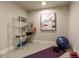 Basement area with space for activities, a fitness mat, and organized shelving at 4430 Alister Park Dr, Cumming, GA 30040