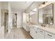 Modern bathroom featuring double vanity, quartz countertops, and a frameless glass shower at 4430 Alister Park Dr, Cumming, GA 30040