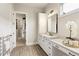 Elegant bathroom showcasing a double vanity and a door to the wardrobe at 4430 Alister Park Dr, Cumming, GA 30040