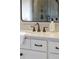 Close-up of a bathroom vanity with quartz countertop and brushed bronze faucet at 4430 Alister Park Dr, Cumming, GA 30040