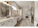 Elegant bathroom showcasing a double vanity and a door to the wardrobe at 4430 Alister Park Dr, Cumming, GA 30040