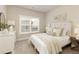Serene bedroom with a plush bed, soft lighting, and a view of the outdoors at 4430 Alister Park Dr, Cumming, GA 30040