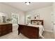 Well-lit bedroom with a wooden bed frame, dresser, and a cozy atmosphere at 4430 Alister Park Dr, Cumming, GA 30040