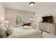 Bright bedroom with ample sunlight, a dresser, and a serene ambiance at 4430 Alister Park Dr, Cumming, GA 30040