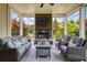 Inviting covered patio features a fireplace and comfortable seating, perfect for relaxation at 4430 Alister Park Dr, Cumming, GA 30040