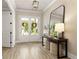 Inviting foyer with console table, elegant decor, and hardwood flooring creating a warm and welcoming atmosphere at 4430 Alister Park Dr, Cumming, GA 30040
