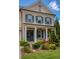 Charming front porch with classic columns, dark shutters, and vibrant landscaping, a welcoming exterior at 4430 Alister Park Dr, Cumming, GA 30040