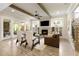 Comfortable living room featuring a fireplace, built-in shelving, and lots of natural light at 4430 Alister Park Dr, Cumming, GA 30040