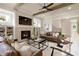 Welcoming living room featuring a fireplace, built-in shelving, and modern furnishings at 4430 Alister Park Dr, Cumming, GA 30040