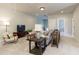 Open-concept living area with neutral tones, a comfortable sofa, and stylish decor at 4430 Alister Park Dr, Cumming, GA 30040