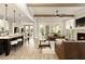 Bright, open-concept living area with a modern kitchen island, cozy fireplace, and stylish leather seating at 4430 Alister Park Dr, Cumming, GA 30040