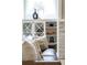 Bright built-in shelves in a living room setting with leather sofa and pillows at 4430 Alister Park Dr, Cumming, GA 30040