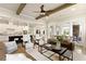 Open concept living room with adjacent kitchen showcasing modern finishes and natural light at 4430 Alister Park Dr, Cumming, GA 30040