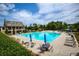 Beautiful community pool with lots of seating and a nearby building for residents to enjoy at 4430 Alister Park Dr, Cumming, GA 30040