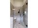Contemporary shower with a glass enclosure and a bench in the tiled enclosure at 4430 Alister Park Dr, Cumming, GA 30040