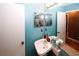 Bathroom featuring a single sink and mirrored cabinets at 1030 Chapman Ln, Stone Mountain, GA 30088