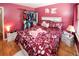 Cozy bedroom featuring a comfortable bed, plush rug, and natural light from the window at 1030 Chapman Ln, Stone Mountain, GA 30088