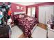 Comfortable bedroom with large bed, window, and closet at 1030 Chapman Ln, Stone Mountain, GA 30088