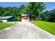 Charming home boasts a stone facade, two-car garage, and a well-maintained front yard, all nestled on a tree-lined lot at 1030 Chapman Ln, Stone Mountain, GA 30088