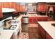 This kitchen features wooden cabinets, modern appliances and an island workstation at 1030 Chapman Ln, Stone Mountain, GA 30088