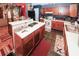 This open kitchen features wooden cabinets, modern appliances and an island workstation at 1030 Chapman Ln, Stone Mountain, GA 30088