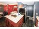 Wide angle shot of kitchen with island and modern appliances and open to dining area at 1030 Chapman Ln, Stone Mountain, GA 30088