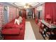 This modern living room boasts a comfortable sofa, TV and stylish decor, and lots of red hues at 1030 Chapman Ln, Stone Mountain, GA 30088