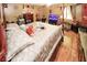 The primary bedroom has a four-poster bed, wood floors and generous natural light at 1030 Chapman Ln, Stone Mountain, GA 30088