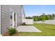 Backyard with a patio, white fence, grassy lawn, and privacy, perfect for outdoor gatherings at 205 Silver Moon Dr, Loganville, GA 30052