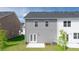 Backyard with a patio, lawn, and exterior of a modern home, perfect for relaxation at 205 Silver Moon Dr, Loganville, GA 30052