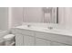 Bathroom featuring double sinks, white cabinetry, and ample counter space at 205 Silver Moon Dr, Loganville, GA 30052