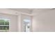 Bedroom with a tray ceiling, recessed lighting, and lots of light from two windows at 205 Silver Moon Dr, Loganville, GA 30052