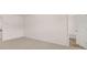 Bedroom with wall-to-wall carpet and view into the bathroom at 205 Silver Moon Dr, Loganville, GA 30052