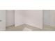 Bedroom with walk-in closet for storage and neutral carpet flooring to complement your decor at 205 Silver Moon Dr, Loganville, GA 30052