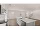 Bright, modern kitchen with a large island, stainless steel appliances, and an open floor plan at 205 Silver Moon Dr, Loganville, GA 30052
