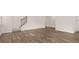 Open living space features wood floors, lots of light, a staircase, and a kitchen with white cabinets at 205 Silver Moon Dr, Loganville, GA 30052