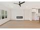 Bright living area with hardwood floors, fireplace, and an open layout to the kitchen at 1995 Deco Dr, Kennesaw, GA 30144