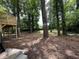 Expansive backyard surrounded by mature trees, offering shade and privacy at 2764 Ocean Valley Dr, Atlanta, GA 30349