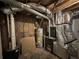 Unfinished basement area features a Goodman furnace, and water heater with exposed ductwork, and utility access at 2764 Ocean Valley Dr, Atlanta, GA 30349