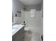 Updated bathroom with new vanity, quartz counters, tile flooring, tub and modern fixtures at 2764 Ocean Valley Dr, Atlanta, GA 30349