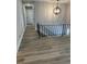 Hallway featuring wood floors, an iron railing, and a modern chandelier at 2764 Ocean Valley Dr, Atlanta, GA 30349