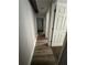 Hallway featuring durable laminate flooring, neutral paint, and bright white doors and trim at 2764 Ocean Valley Dr, Atlanta, GA 30349