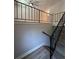 Staircase with modern railing and carpeting, providing safe and stylish access at 2764 Ocean Valley Dr, Atlanta, GA 30349
