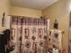 Unique bathroom featuring a stylish shower curtain and coordinated decor at 3939 Craggy Perch, Douglasville, GA 30135