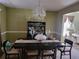 Inviting dining room with elegant chandelier, decorative china cabinet, and bright, natural lighting at 3939 Craggy Perch, Douglasville, GA 30135