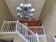 Elegant foyer with decorative chandelier, staircase, and eye-catching accent wall at 3939 Craggy Perch, Douglasville, GA 30135